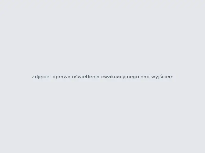 Oprawa oświetlenia ewakuacyjnego nad wyjściem z budynku